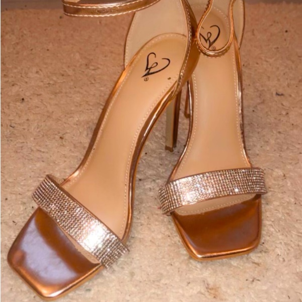 Size 7 high end rose gold stilettos worn once, bought from Puerto Rico. OBO